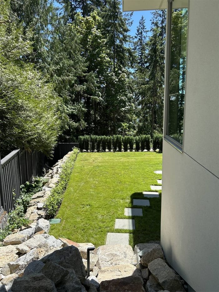 Backyard lawn renovation with stepping-stone paver path in Metro Vancouver