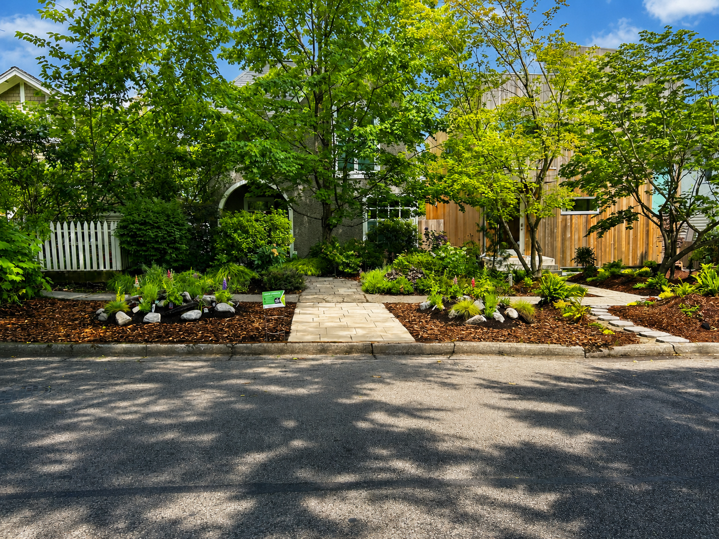 Paver walkway installation with mulch beds and plant landscaping by Coastal Property Services in Metro Vancouver